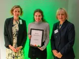 A photo of Dr Victoria Norton receiving her award at the BNF Annual Conference